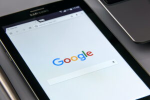 zoom in on tablet displaying google homepage - Paid Advertising