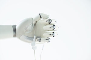 robotic hand holding earphones