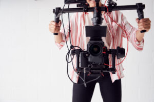 Female Videographer With Video Camera